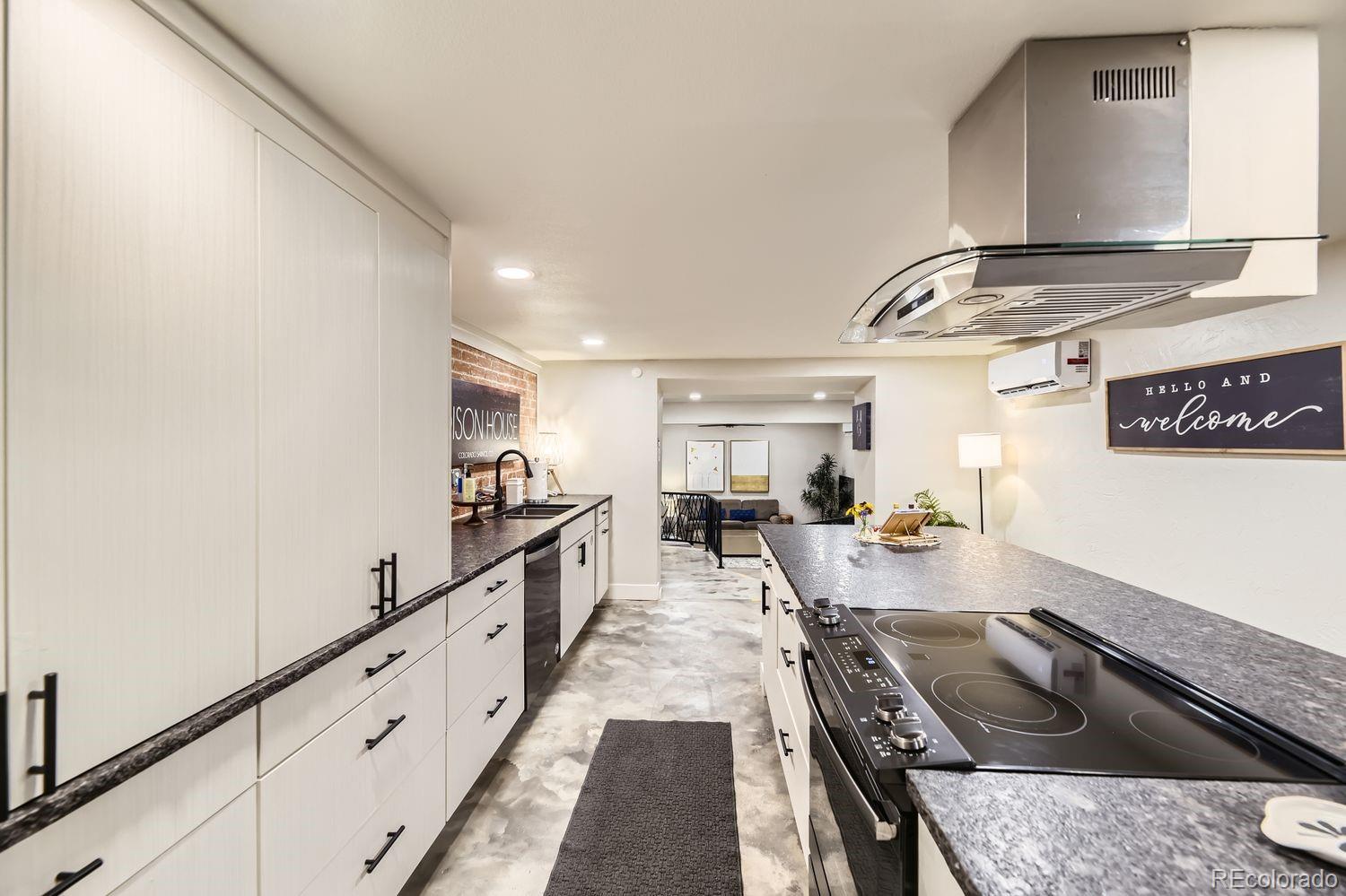 2132 North Nevada Avenue Colorado Springs, CO 80907 - Photo 13 of 26 a kitchen with sink stove and cabinets
