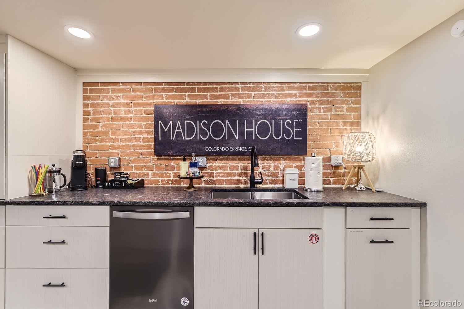 2132 North Nevada Avenue Colorado Springs, CO 80907 - Photo 14 of 26 a kitchen with stainless steel appliances granite countertop a sink and a window