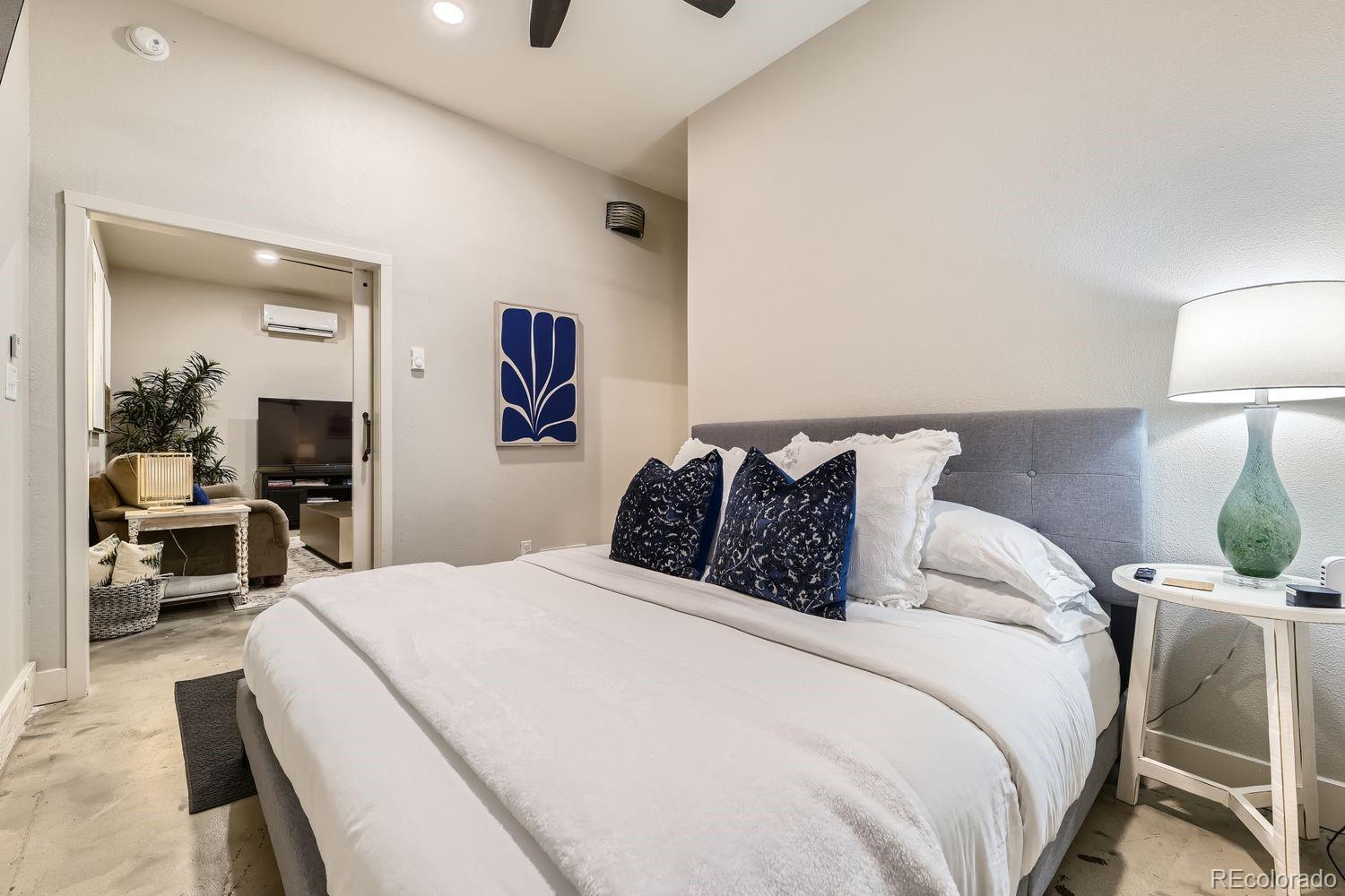 2132 North Nevada Avenue Colorado Springs, CO 80907 - Photo 16 of 26 a bed room with a bed and a mirror