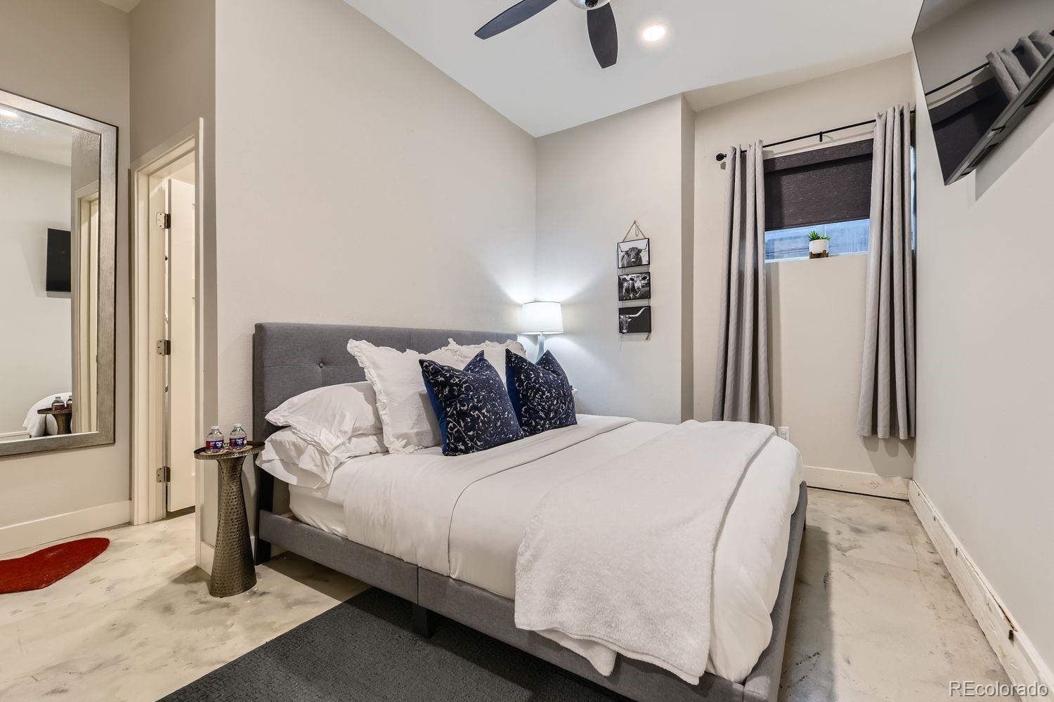 2132 North Nevada Avenue Colorado Springs, CO 80907 - Photo 22 of 26 a bedroom with bed and a tv