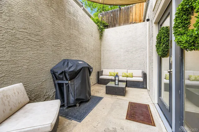 a living room with furniture and a rug