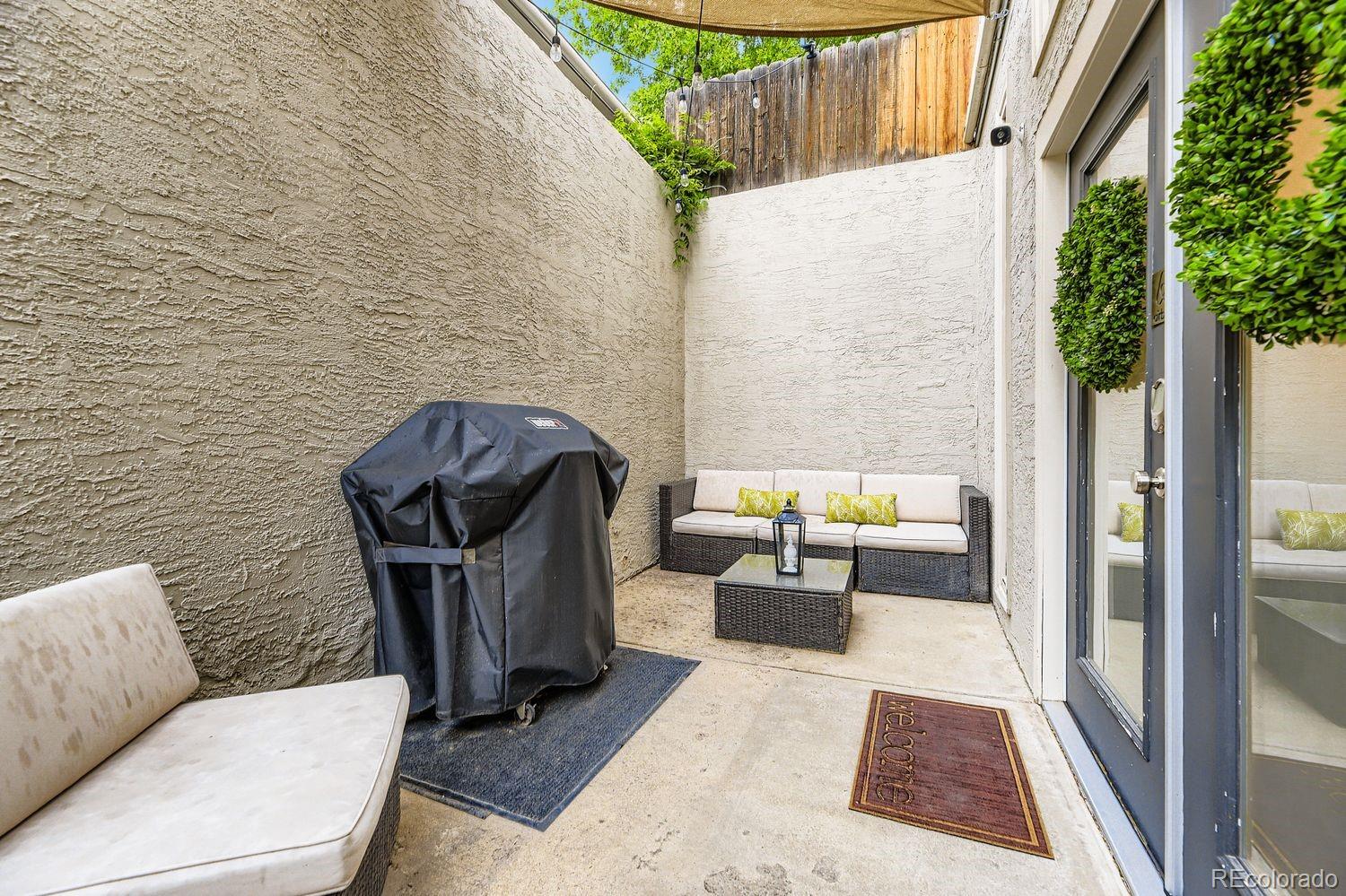 2132 North Nevada Avenue Colorado Springs, CO 80907 - Photo 3 of 26 a living room with furniture and a rug