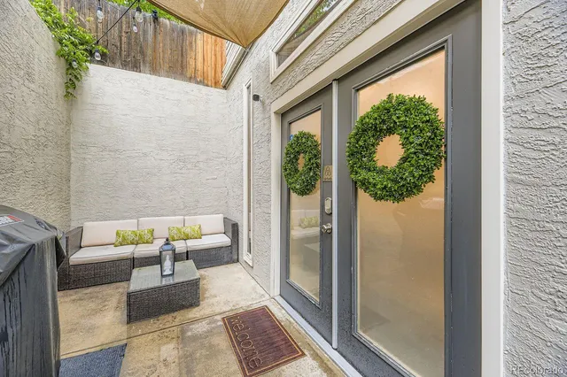 a view of a balcony with furniture