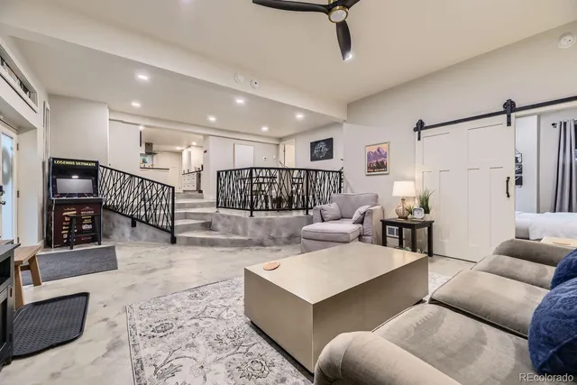 a living room with furniture and a rug