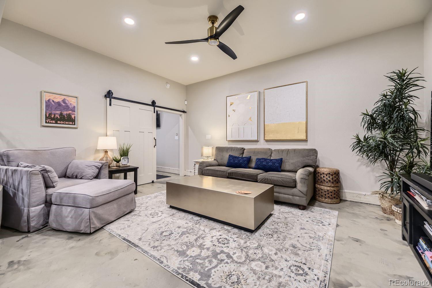 2132 North Nevada Avenue Colorado Springs, CO 80907 - Photo 10 of 26 a living room with furniture and a potted plant