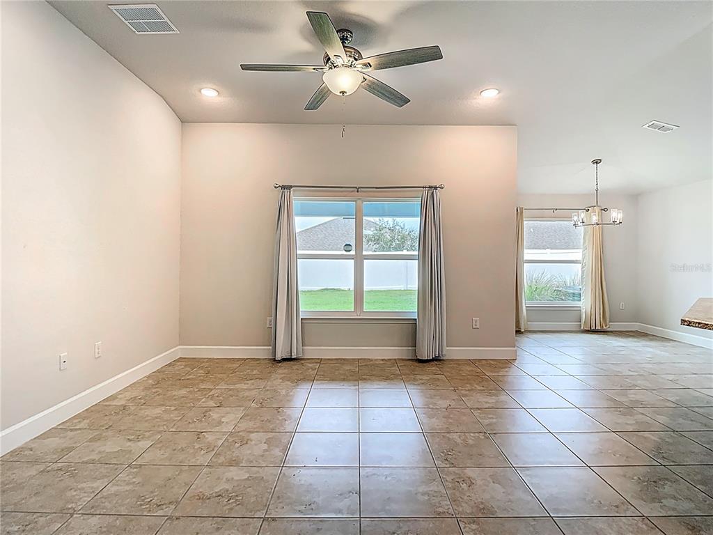 14917 Tropical Violet Way Wimauma, FL 33598 - Photo 11 of 77 a view of an empty room with a window
