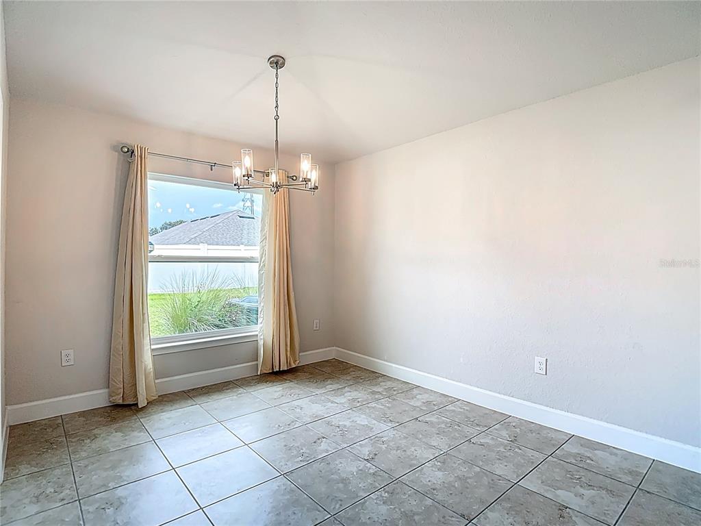 14917 Tropical Violet Way Wimauma, FL 33598 - Photo 25 of 77 a view of an empty room with a window