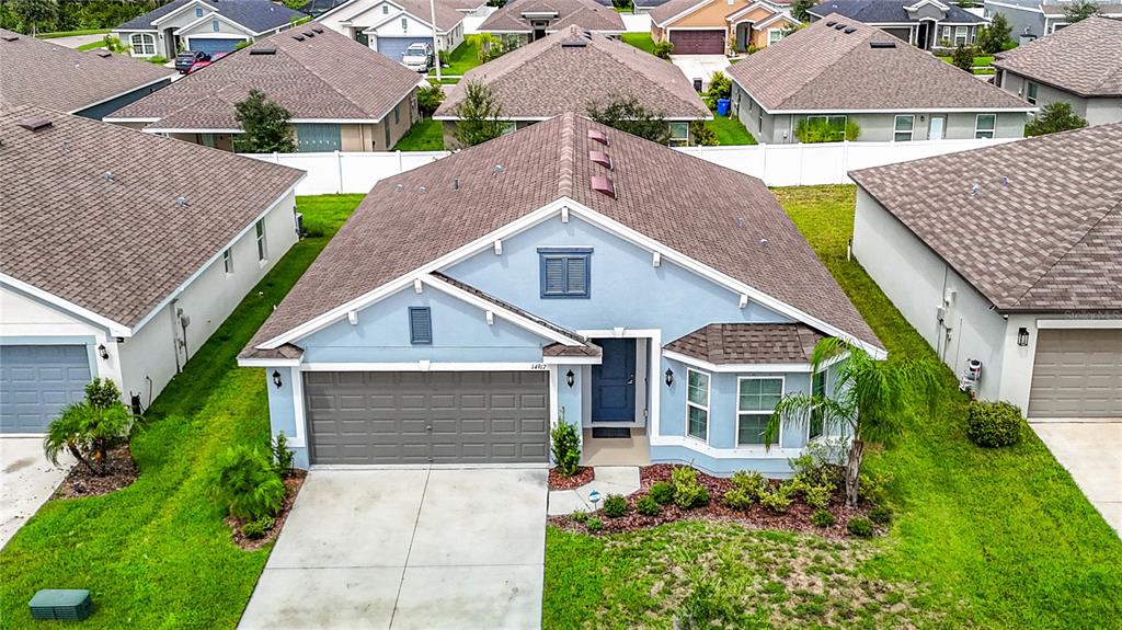 14917 Tropical Violet Way Wimauma, FL 33598 - Photo 4 of 77 front view of a house with a yard