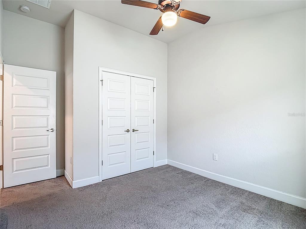 14917 Tropical Violet Way Wimauma, FL 33598 - Photo 44 of 77 an empty room with a empty space