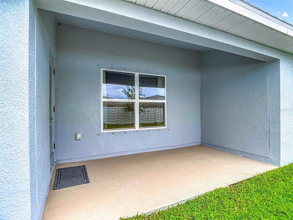 14917 Tropical Violet Way Wimauma, FL 33598 - Photo 53 of 77 a view of an empty room with a window