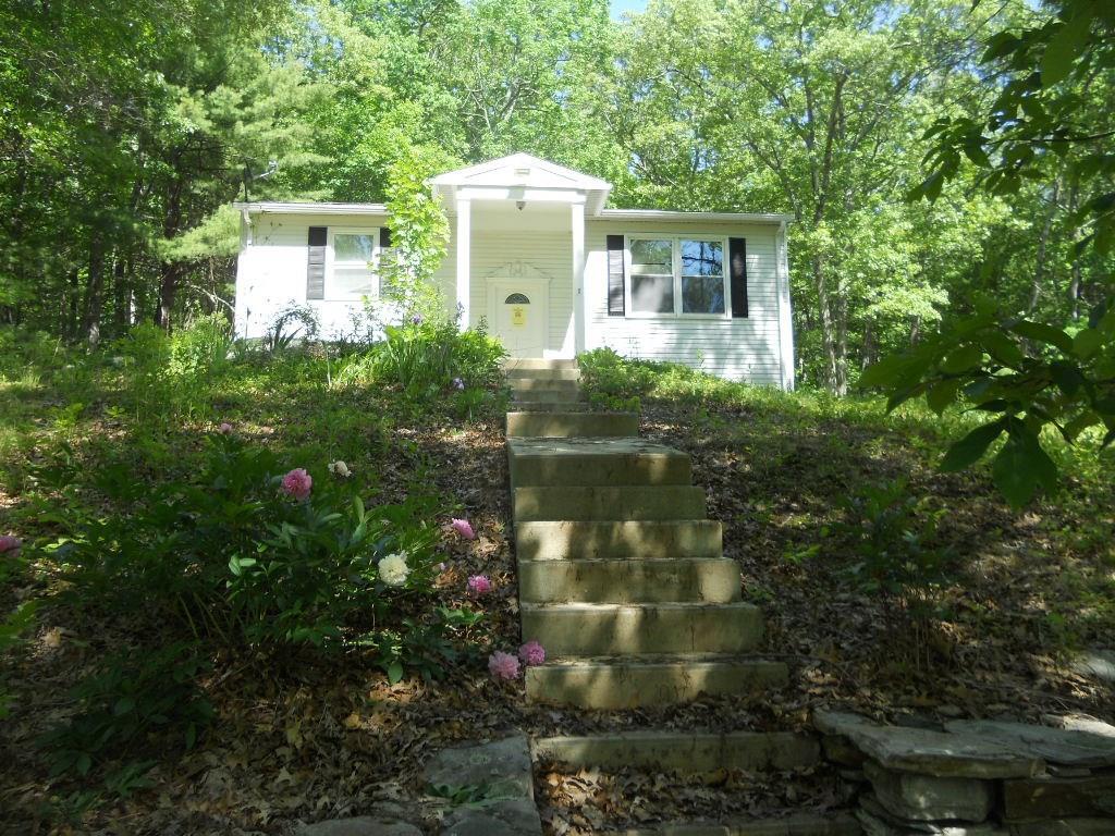108 Breakneck Hill Road Killingly, CT 06241 - Photo 1 of 1 a front view of house with yard and trees
