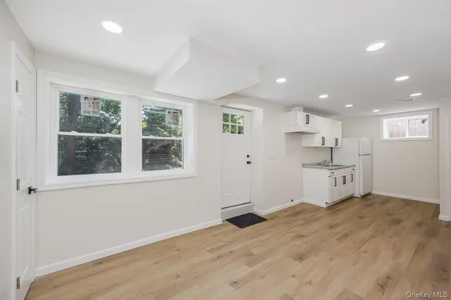 a view of a kitchen with furniture and windows