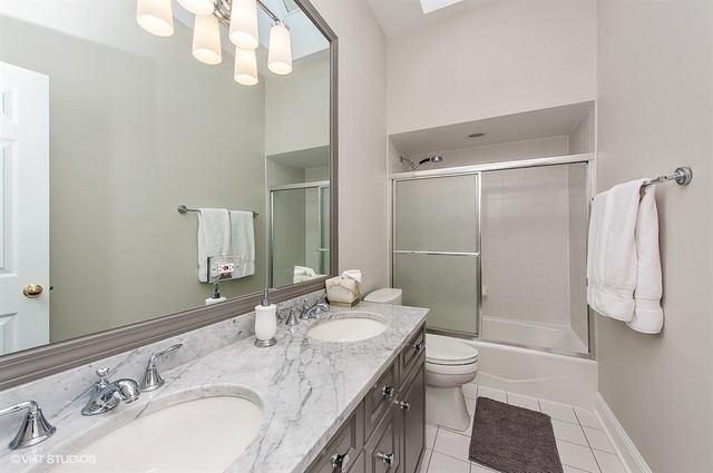 920 Bluff Street Glencoe, IL 60022 - Photo 14 of 29 a bathroom with a granite countertop sink toilet and shower