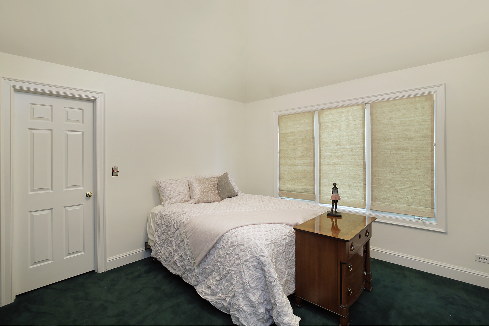 920 Bluff Street Glencoe, IL 60022 - Photo 19 of 29 a bedroom with a bed and a window