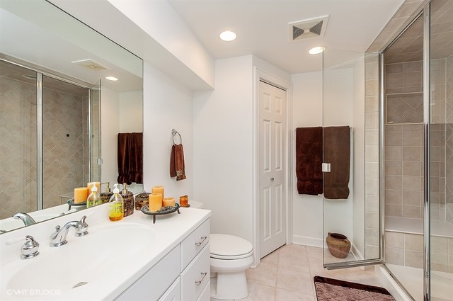 920 Bluff Street Glencoe, IL 60022 - Photo 22 of 29 a bathroom with a sink a toilet and shower
