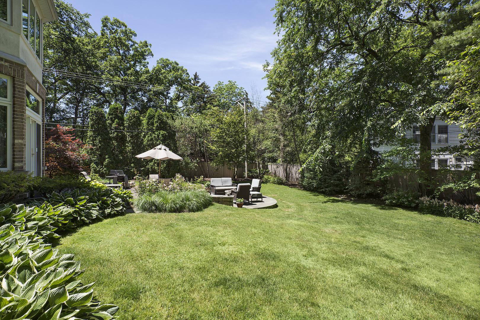 920 Bluff Street Glencoe, IL 60022 - Photo 29 of 29 a view of a backyard with a patio