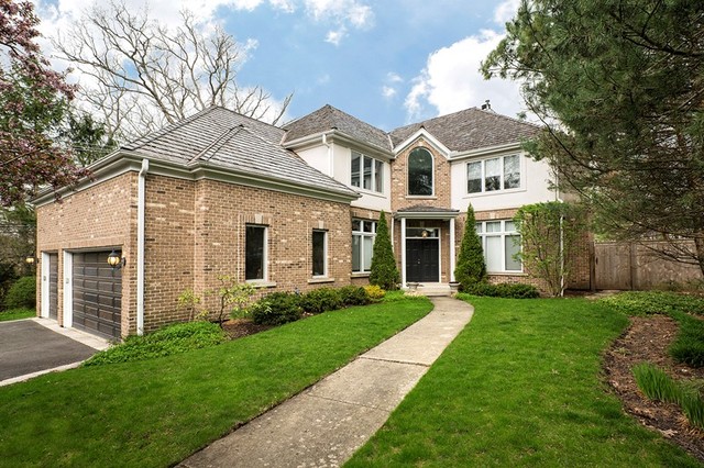 920 Bluff Street Glencoe, IL 60022 - Photo 3 of 29 a front view of a house with a garden