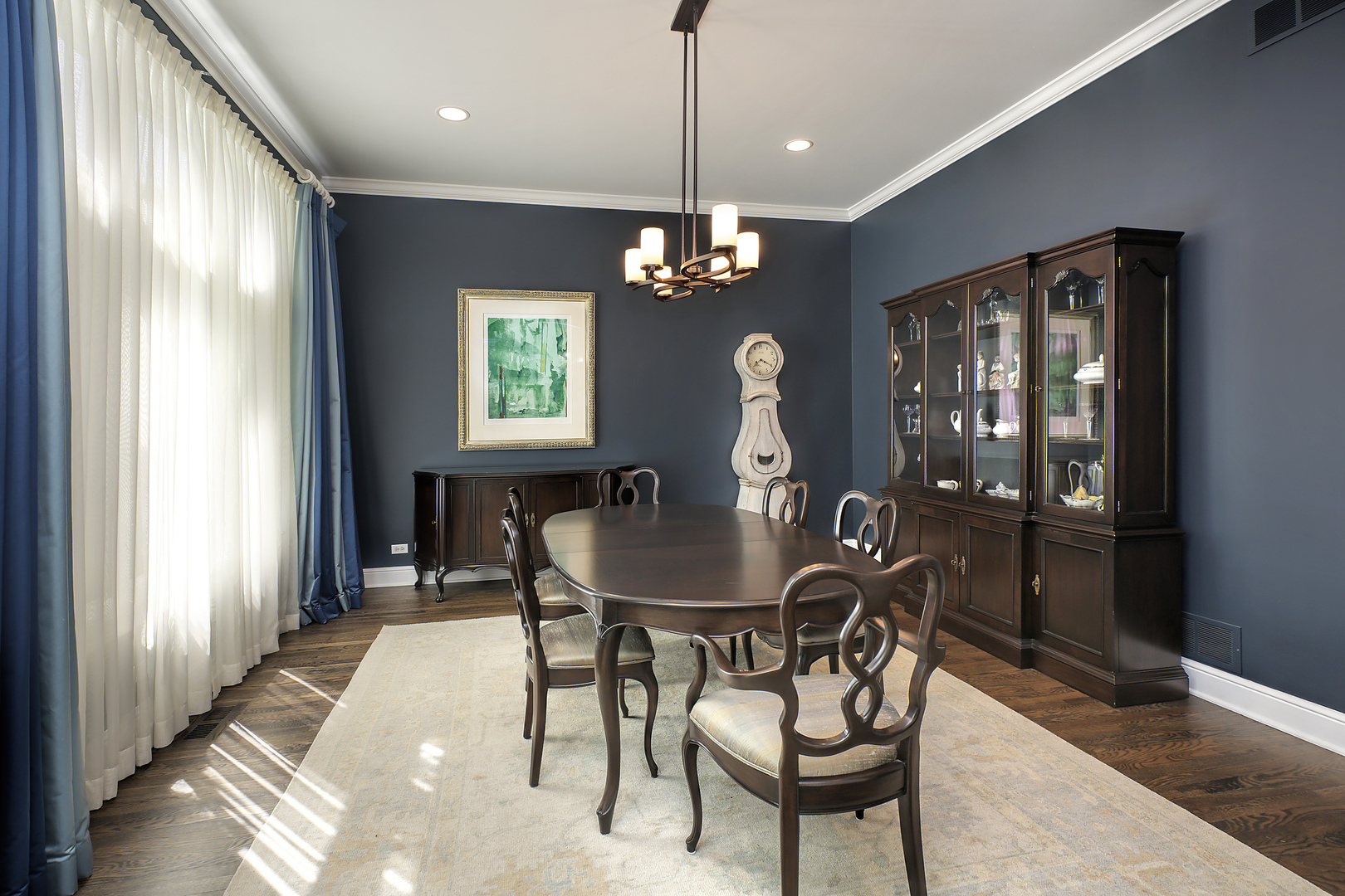 920 Bluff Street Glencoe, IL 60022 - Photo 6 of 29 a dining room with furniture a chandelier and wooden floor