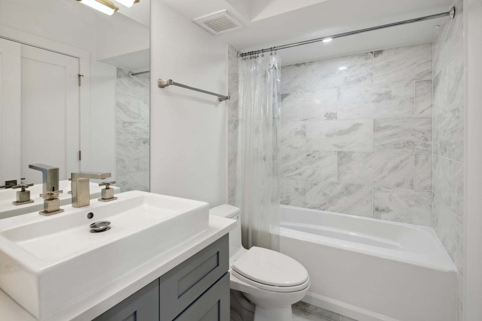 175 East Delaware Place, Unit 7204 Chicago, IL 60611 - Photo 12 of 30 a bathroom with a sink toilet and shower