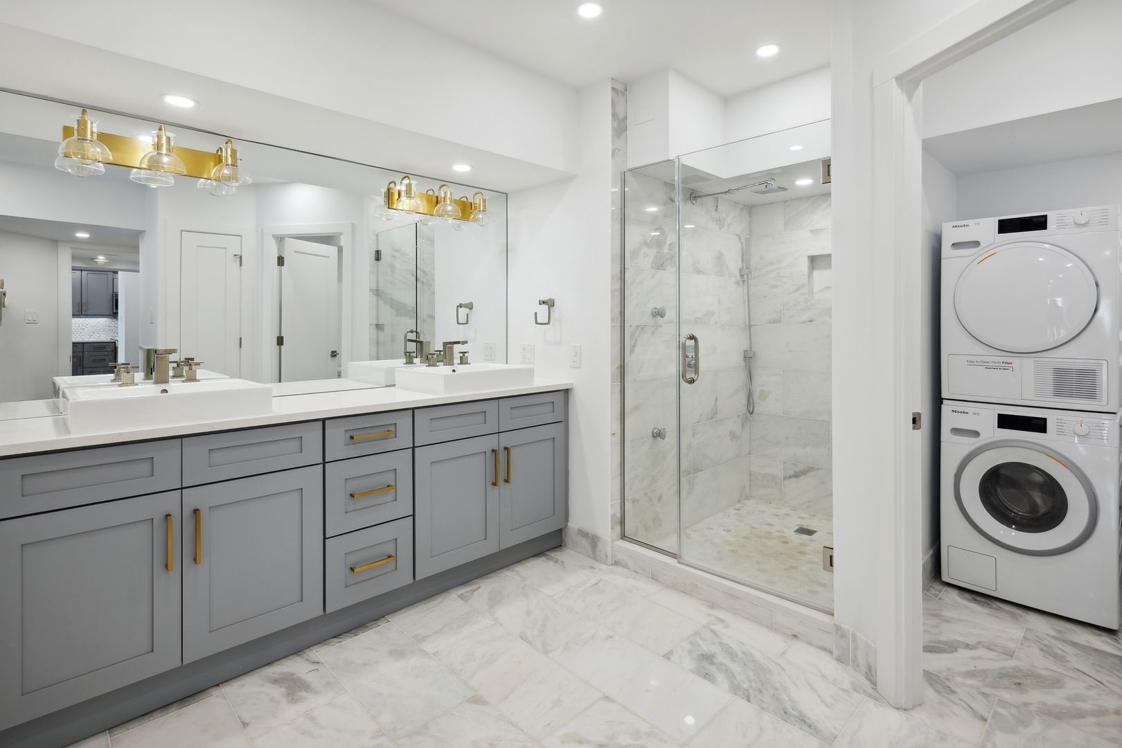 175 East Delaware Place, Unit 7204 Chicago, IL 60611 - Photo 15 of 30 a spacious bathroom with a shower sink mirror and toilet