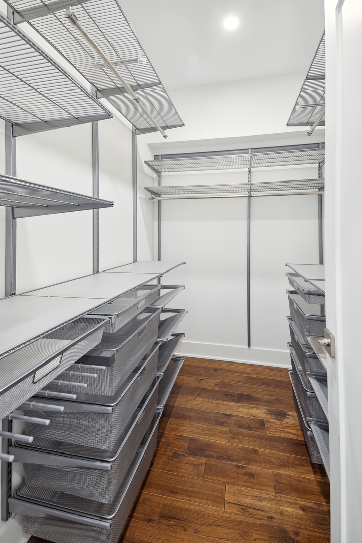 175 East Delaware Place, Unit 7204 Chicago, IL 60611 - Photo 18 of 30 a bedroom with a bed and a window