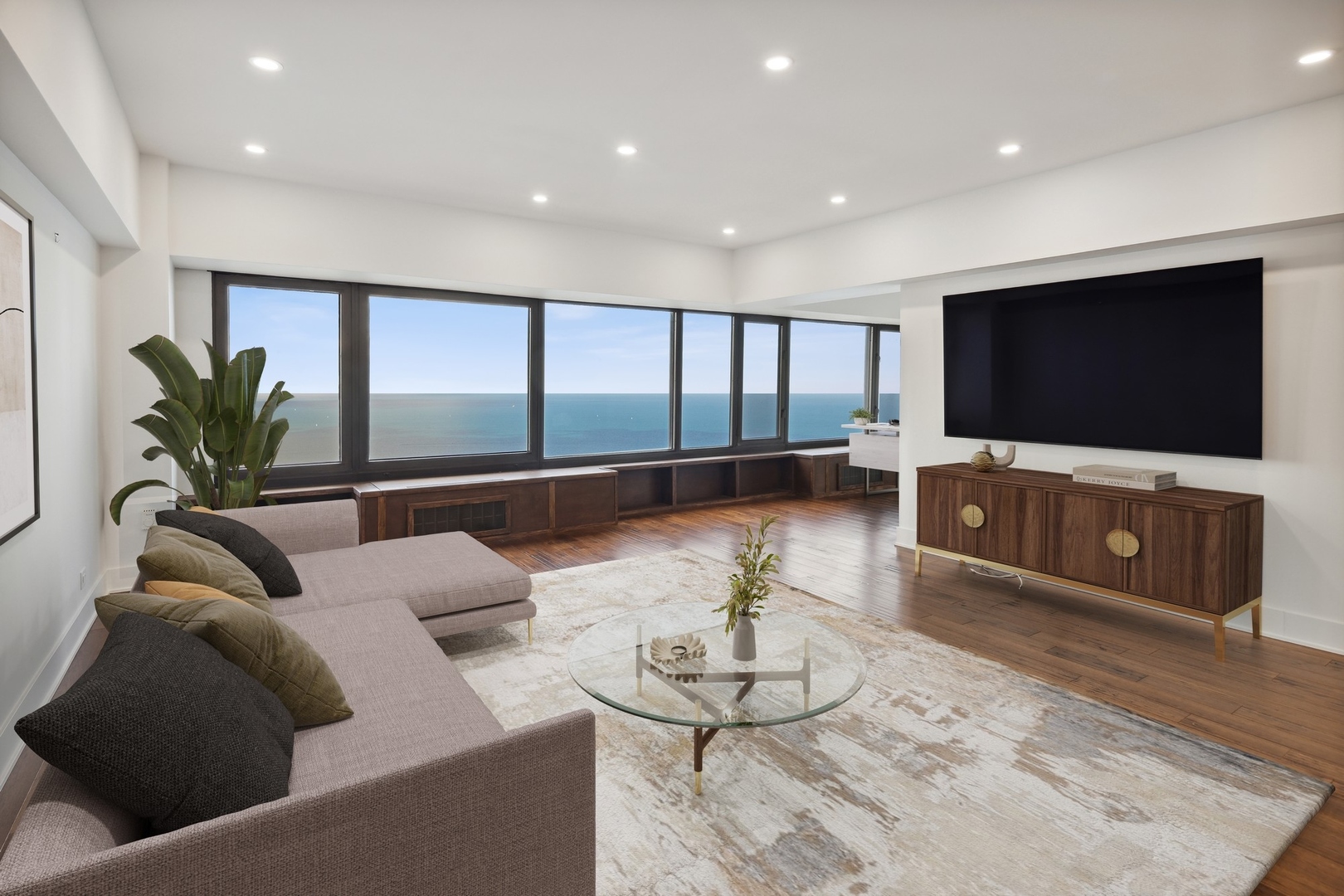 175 East Delaware Place, Unit 7204 Chicago, IL 60611 - Photo 2 of 30 a living room with furniture and a flat screen tv