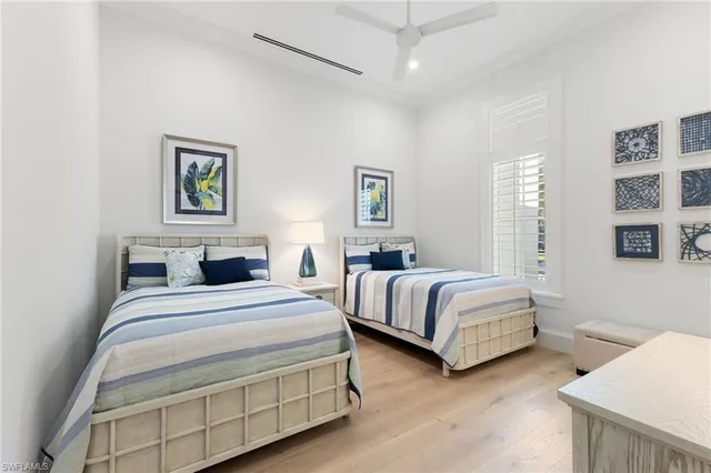 a bedroom with bed and a night stand