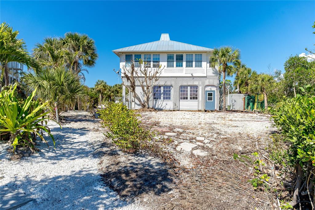 20 Palm Drive Placida, FL 33946 - Photo 11 of 46 a front view of a house with a yard