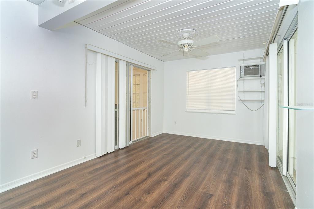 20 Palm Drive Placida, FL 33946 - Photo 16 of 46 wooden floor in an empty room with a window