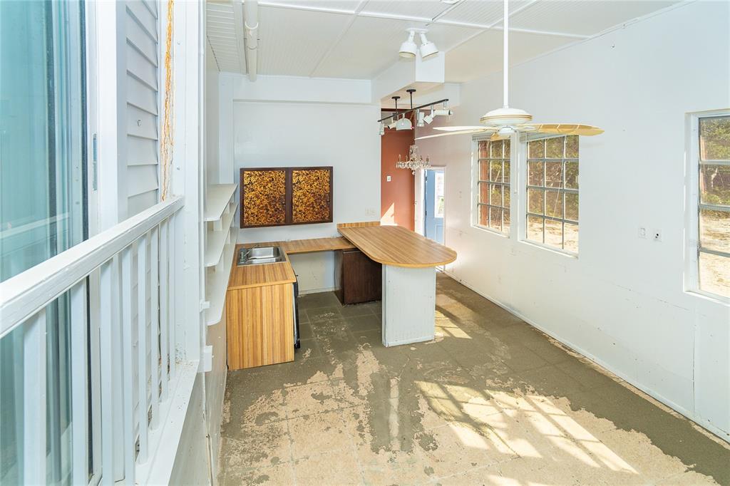 20 Palm Drive Placida, FL 33946 - Photo 17 of 46 a view of a hallway with wooden floor and a window