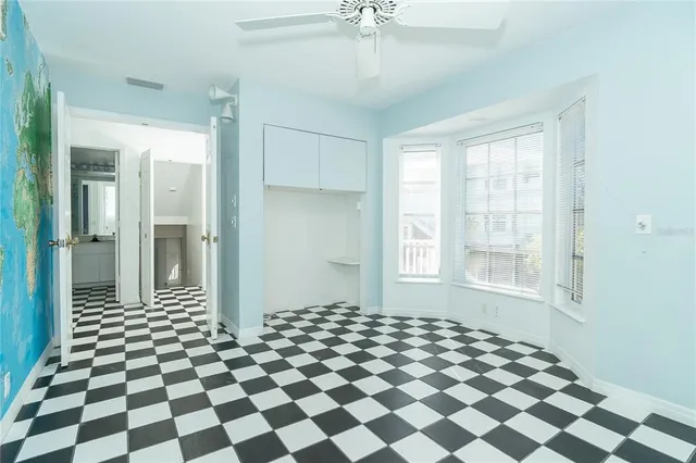 a view of a bathroom with a black and white checkered floor