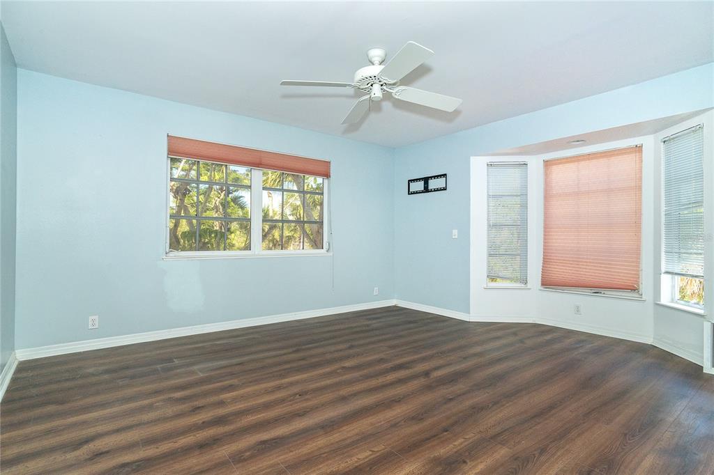 20 Palm Drive Placida, FL 33946 - Photo 20 of 46 a view of an empty room with wooden floor and a window