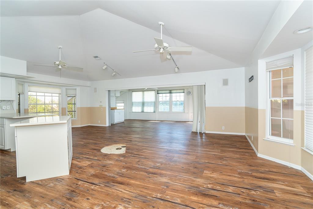 20 Palm Drive Placida, FL 33946 - Photo 25 of 46 a view of an empty room with wooden floor and a window