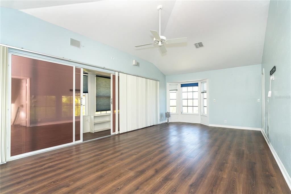 20 Palm Drive Placida, FL 33946 - Photo 33 of 46 a view of an empty room with wooden floor and a window