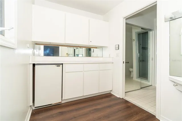 a view of a house with wooden floor and white walls