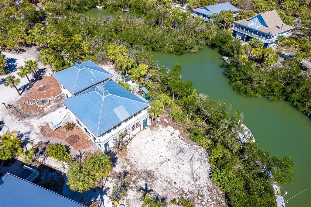20 Palm Drive Placida, FL 33946 - Photo 46 of 46 an aerial view of a house with a garden and lake view