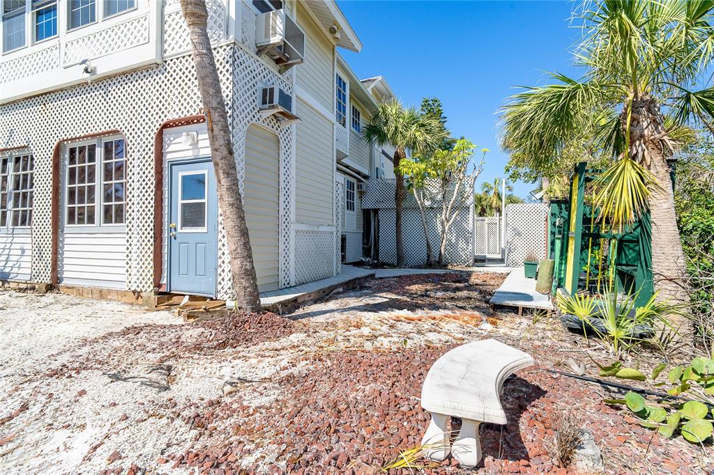 20 Palm Drive Placida, FL 33946 - Photo 6 of 46 a backyard of a house with table and chairs