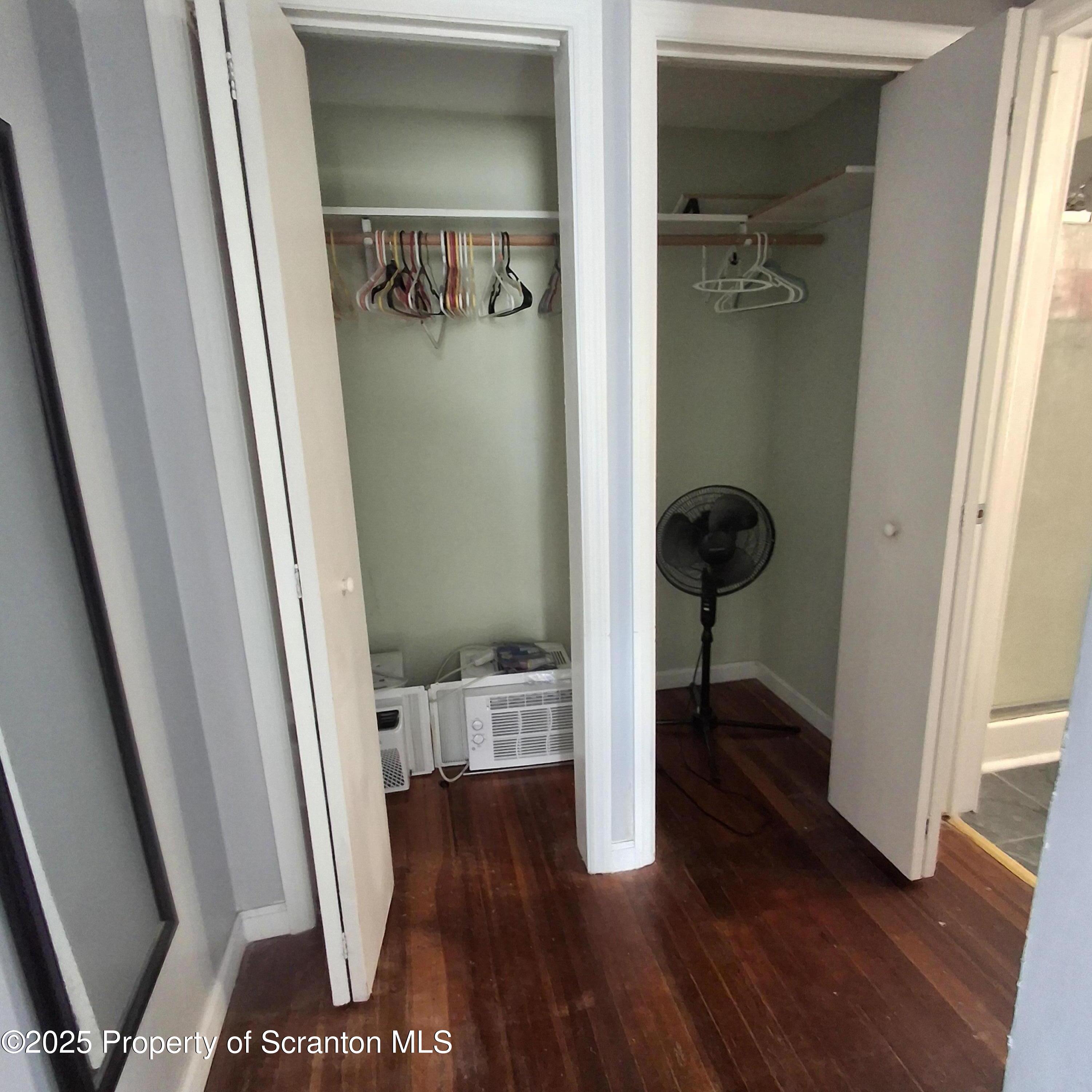 430 Salem Road Archbald, PA 18403 - Photo 13 of 19 a view of a hallway with wooden floor and a bathroom