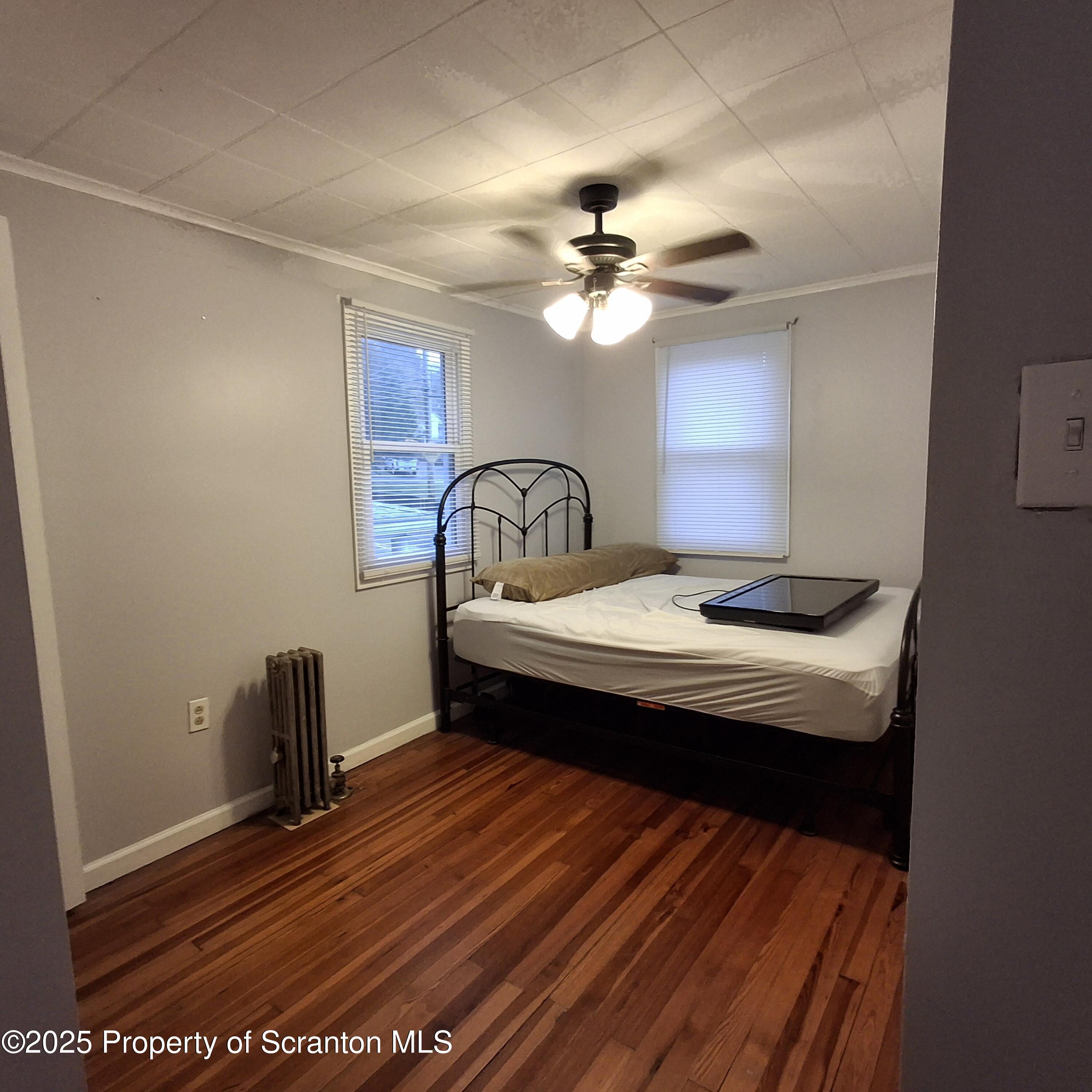 430 Salem Road Archbald, PA 18403 - Photo 15 of 19 a bedroom with a bed and a ceiling fan
