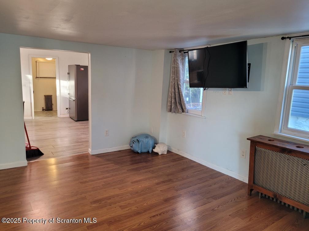 430 Salem Road Archbald, PA 18403 - Photo 5 of 19 a view of a livingroom with wooden floor and flat screen tv