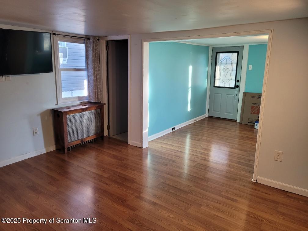 430 Salem Road Archbald, PA 18403 - Photo 6 of 19 an empty room with wooden floor and windows