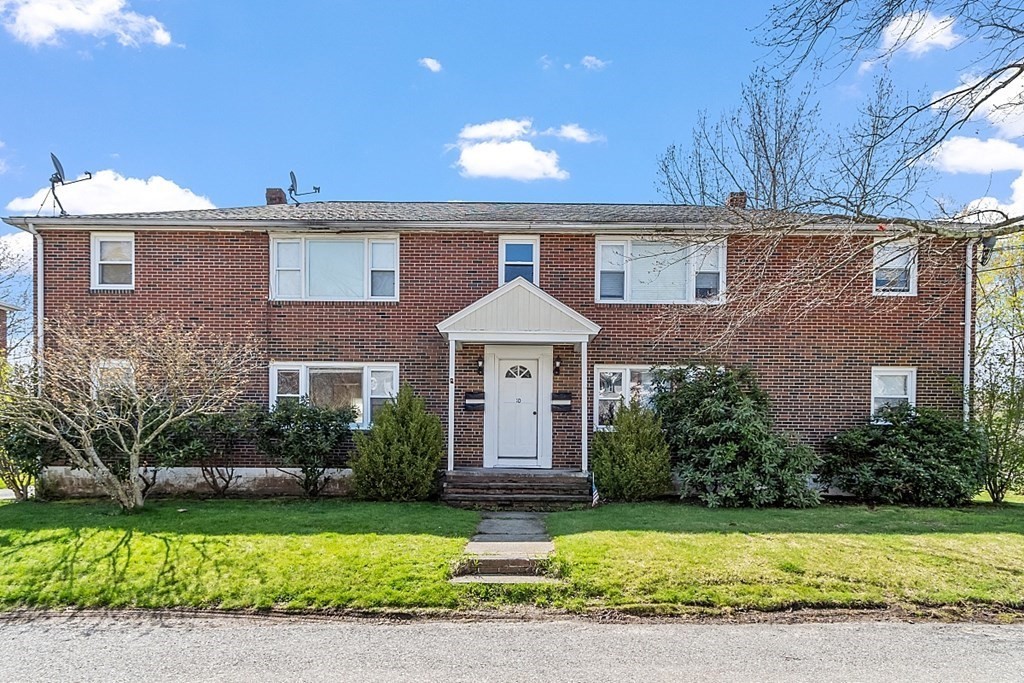 10 Vecchia Street, Unit C Webster, MA 01570 - Photo 1 of 29 a front view of a house with a garden and plants