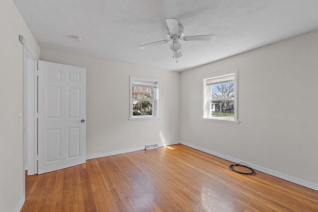10 Vecchia Street, Unit C Webster, MA 01570 - Photo 11 of 29 a view of empty room with wooden floor