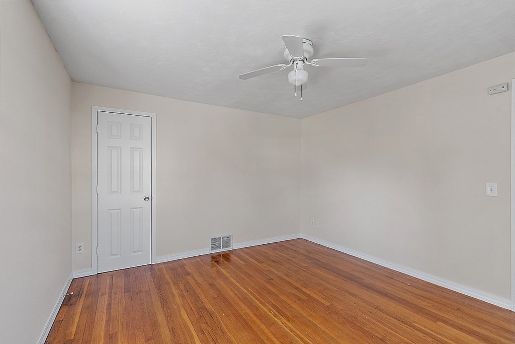 10 Vecchia Street, Unit C Webster, MA 01570 - Photo 13 of 29 a view of empty room with wooden floor