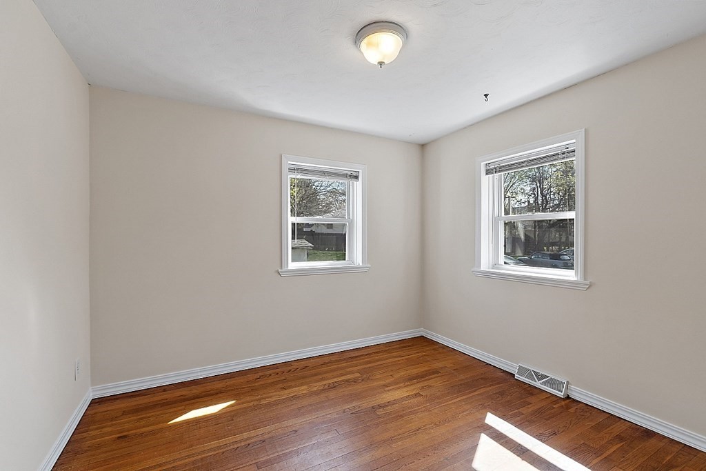 10 Vecchia Street, Unit C Webster, MA 01570 - Photo 14 of 29 a view of empty room with wooden floor and fan