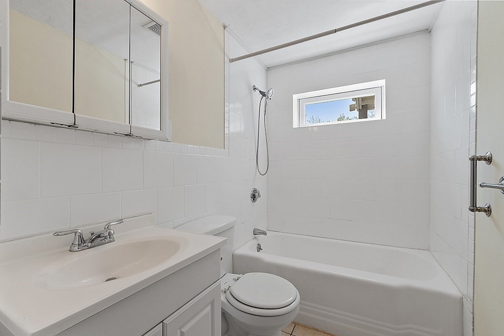 10 Vecchia Street, Unit C Webster, MA 01570 - Photo 18 of 29 a bathroom with a sink a toilet and shower