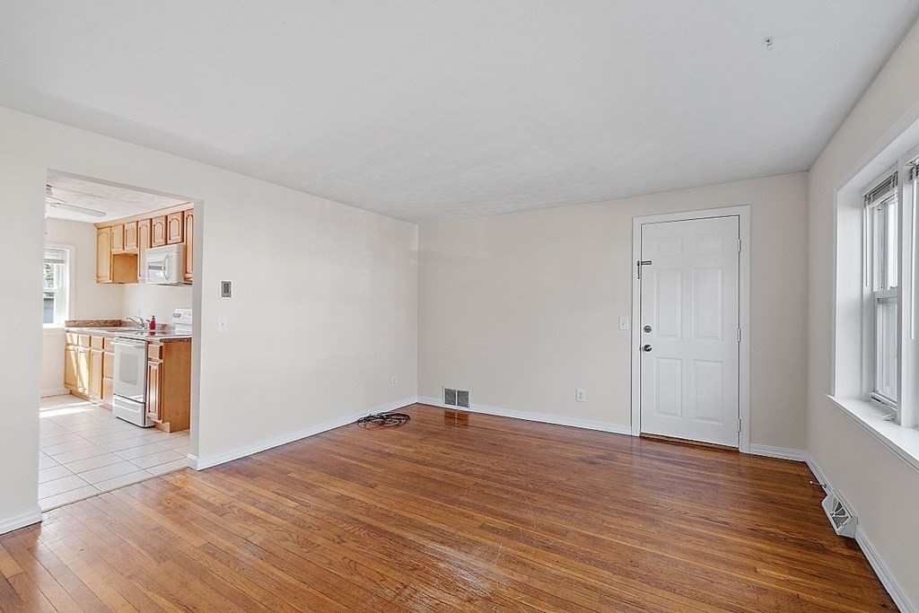 10 Vecchia Street, Unit C Webster, MA 01570 - Photo 5 of 29 a big room with wooden floor and windows