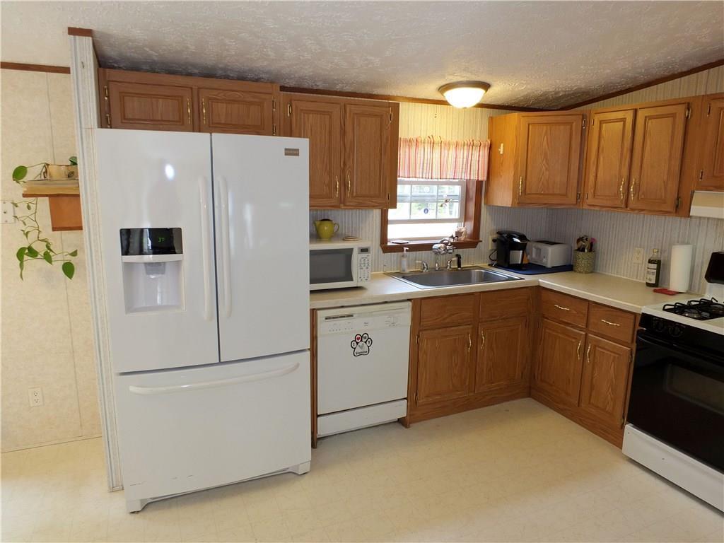 15 Valley Road Boothbay, ME 04537 - Photo 6 of 34 Gas stove, dishwasher and cabinet...