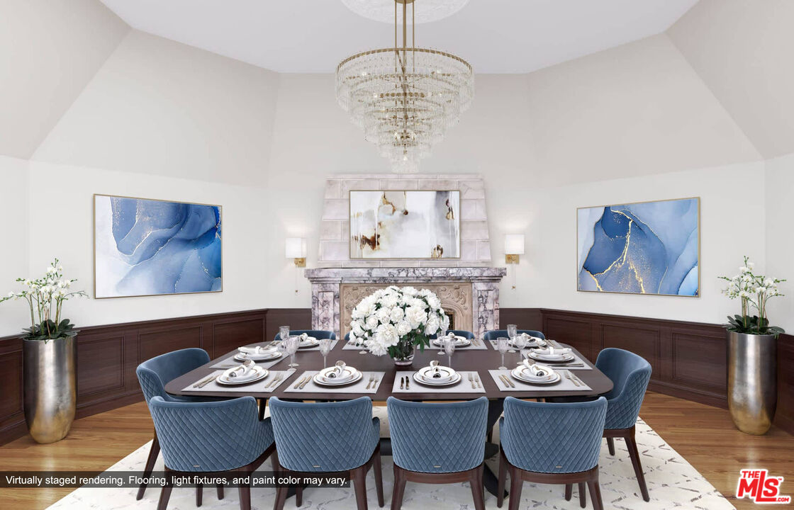 25045 Jim Bridger Road Hidden Hills, CA 91302 - Photo 19 of 52 a view of a dining room with furniture wooden floor and a chandelier