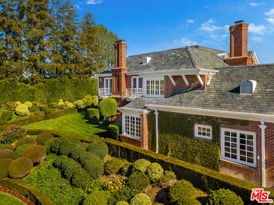 25045 Jim Bridger Road Hidden Hills, CA 91302 - Photo 2 of 52 a front view of a house with a yard